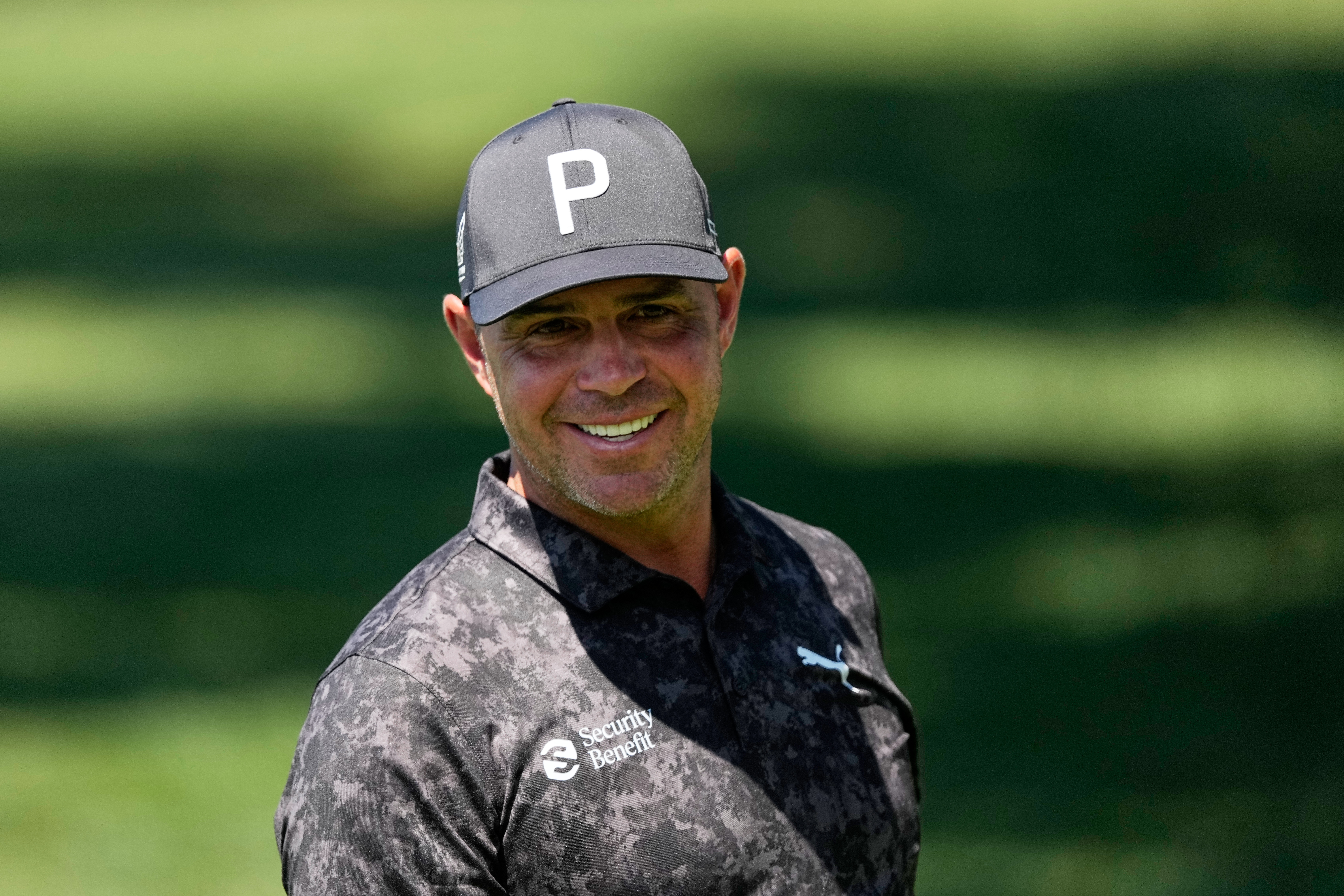 Gary Woodland smiles on the driving range before a practice round ahead of the Masters golf tournament at the Augusta National Golf Club, Tuesday, April 7, 2026, in Augusta, Ga. 