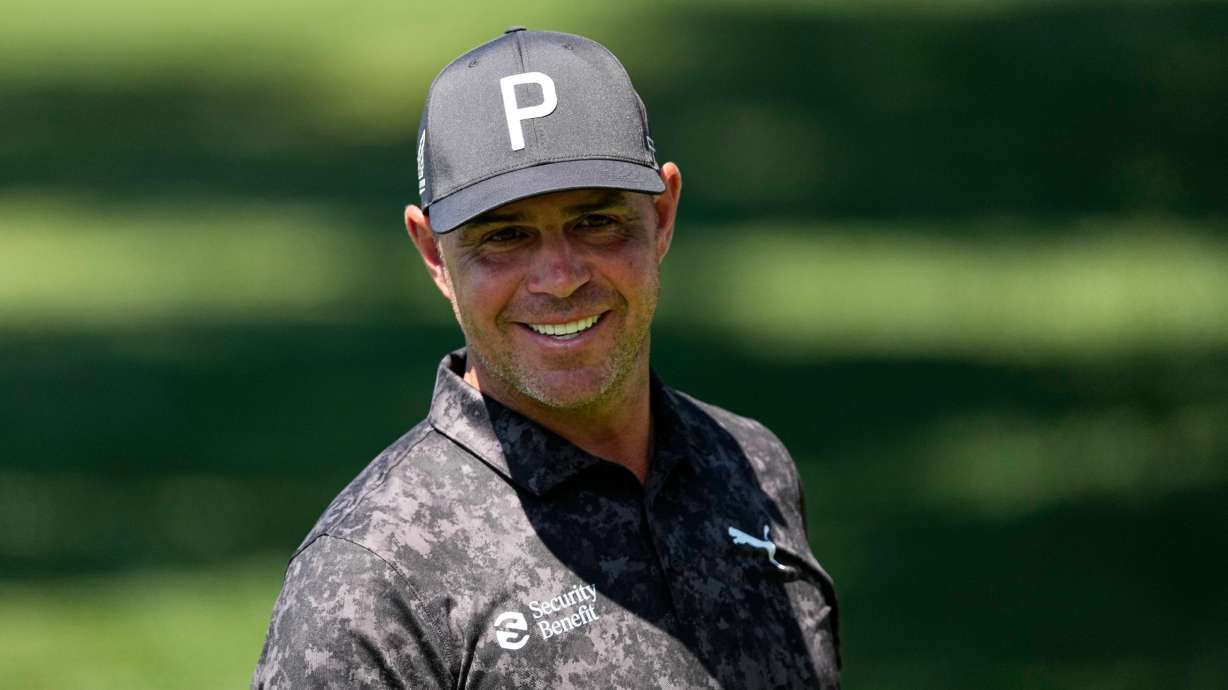Gary Woodland smiles on the driving range before a practice round ahead of the Masters golf tournament at the Augusta National Golf Club, Tuesday, April 7, 2026, in Augusta, Ga.