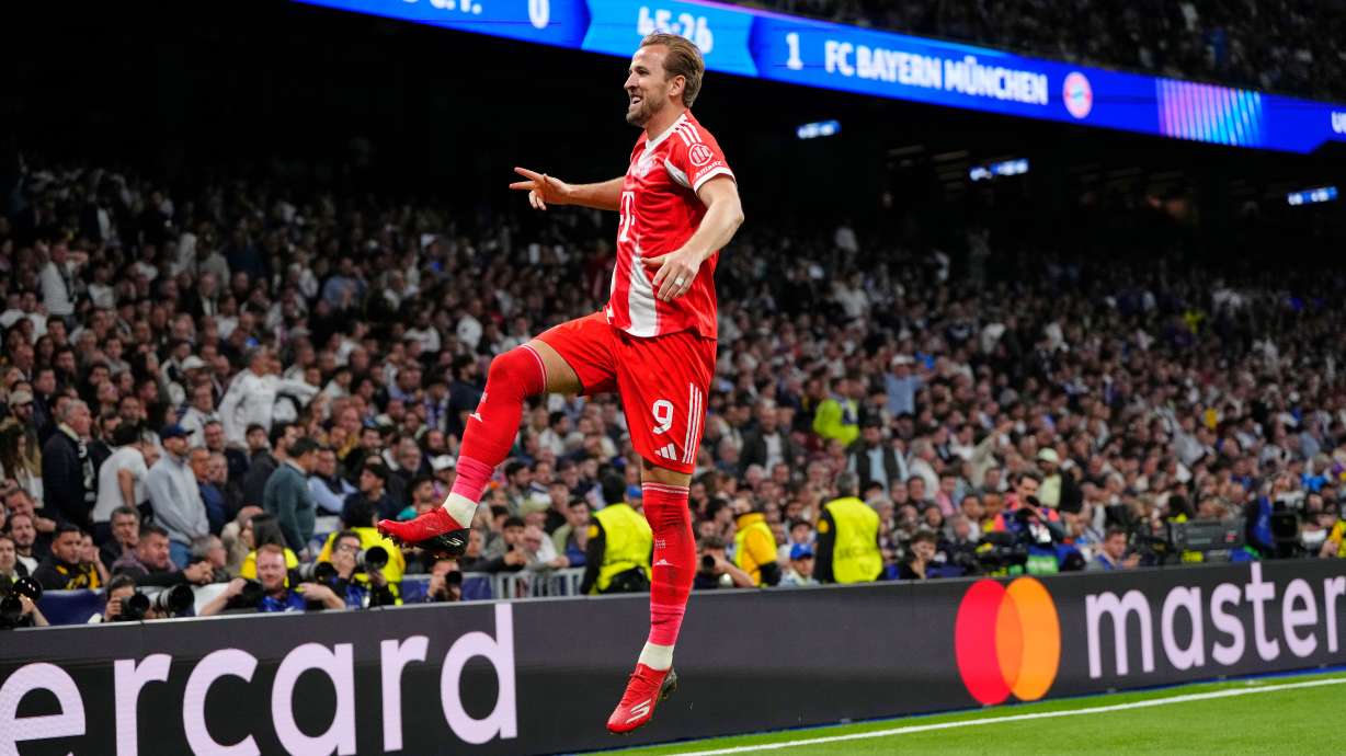 Bayern's Harry Kane celebrates scoring his side's second goal during the Champions League quarterfinal first leg soccer match between Real Madrid and Bayern Munich in Madrid, Spain, Tuesday, April 7, 2026.