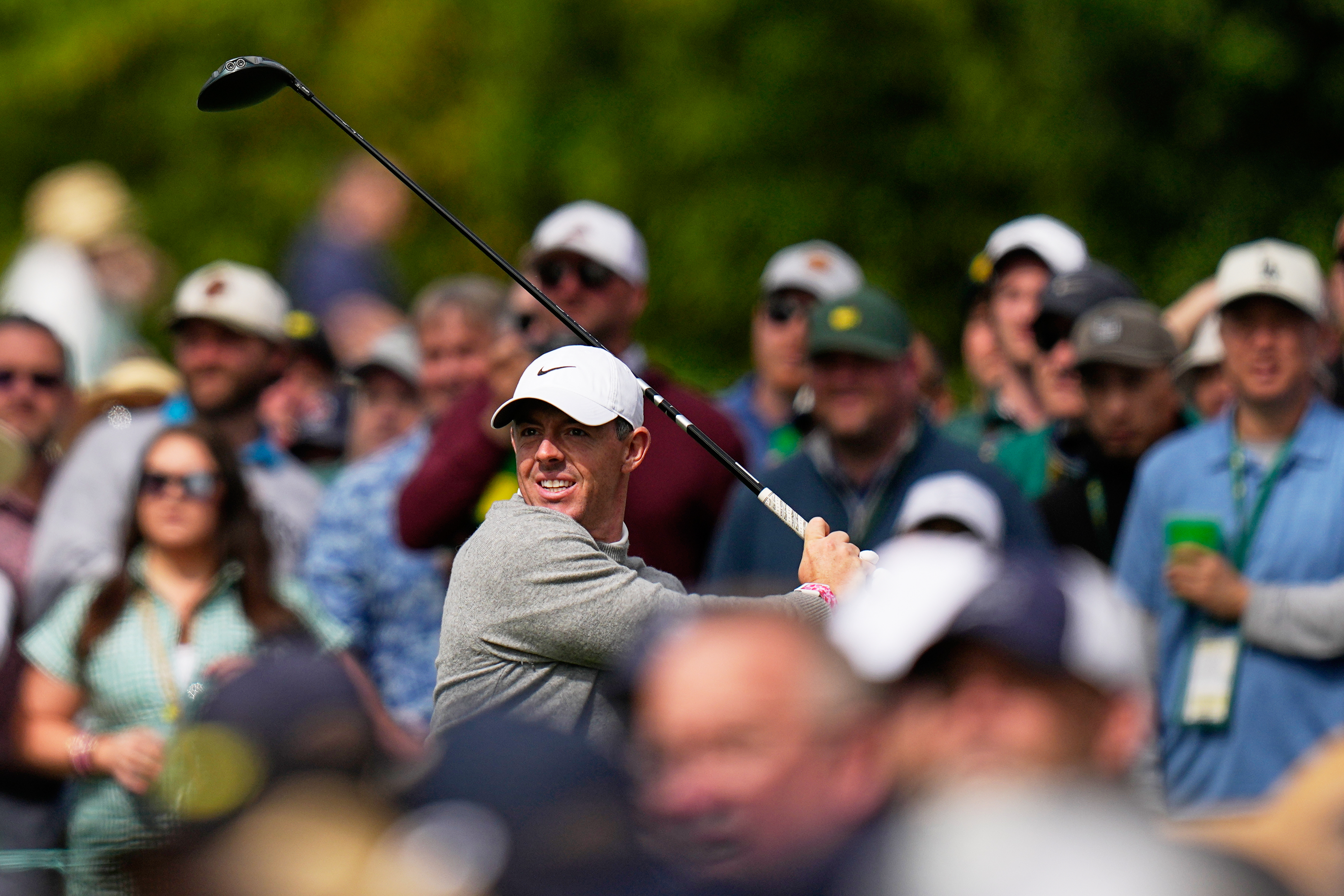 Rory McIlroy, of Northern Ireland, watches his tee shot on the 17th hole during a practice round ahead of the Masters golf tournament at the Augusta National Golf Club, Tuesday, April 7, 2026, in Augusta, Ga. 