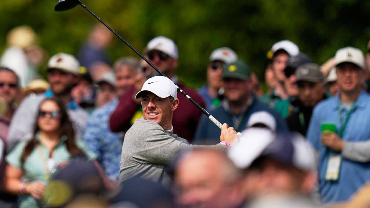 Rory McIlroy, of Northern Ireland, watches his tee shot on the 17th hole during a practice round ahead of the Masters golf tournament at the Augusta National Golf Club, Tuesday, April 7, 2026, in Augusta, Ga.