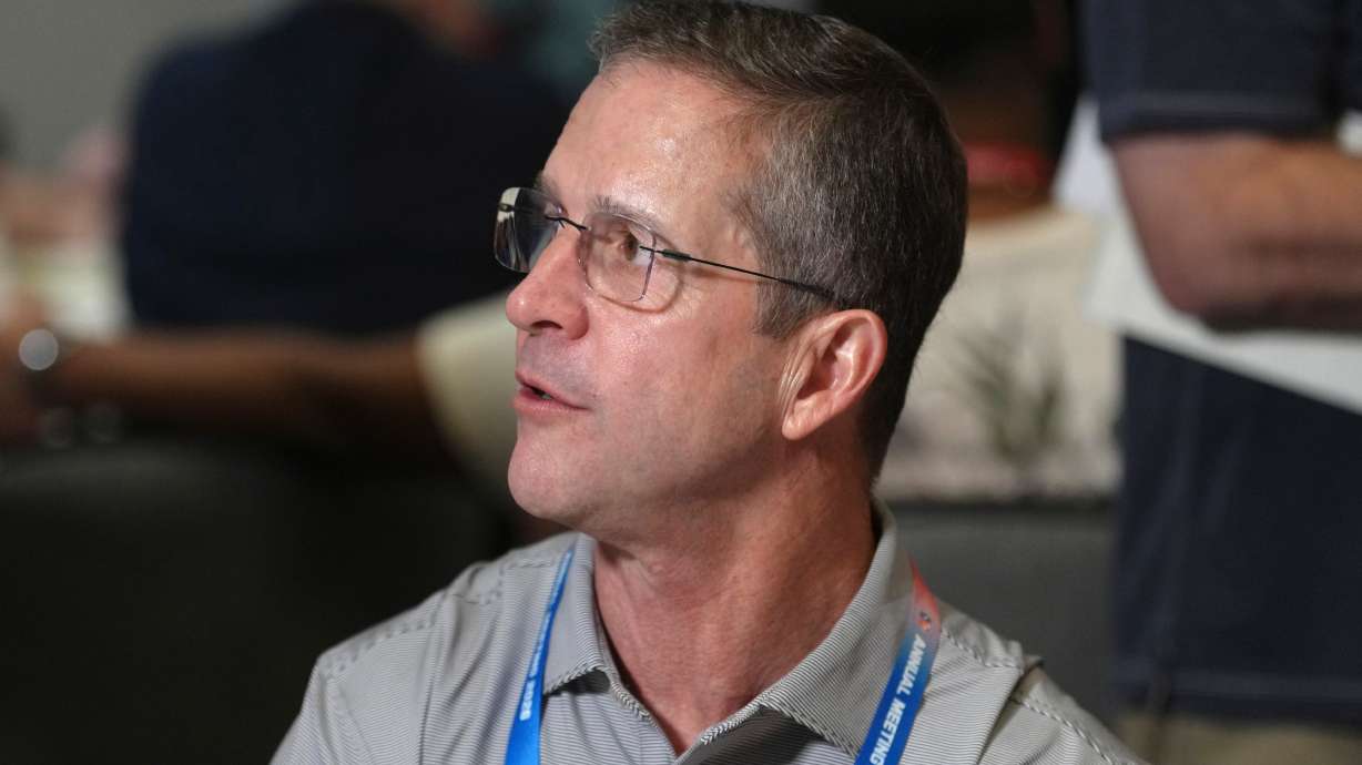 New York Giants head coach John Harbaugh talks with reporters at the annual NFL football meetings, Monday, March 30, 2026, in Phoenix.