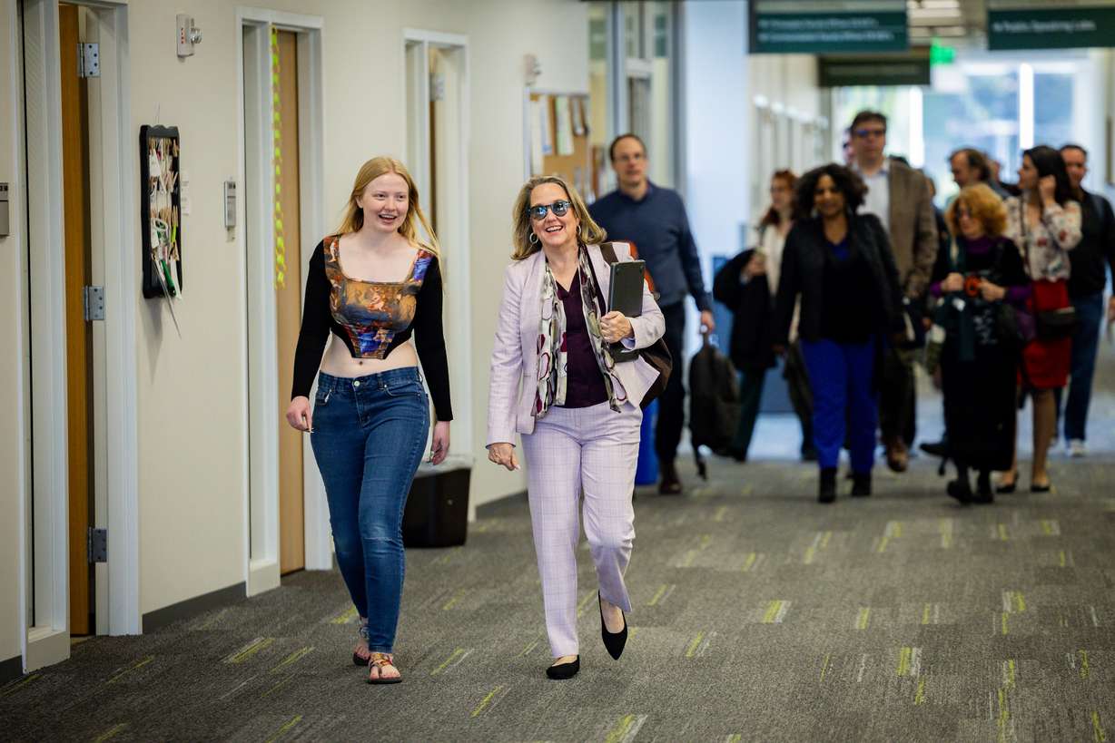 Christy Chapman, assistant research professor of computer science at the University of Kentucky right, walks with Herculaneum intern and UVU student Jade Kempton, left, as part of The Buried Library, an international Herculaneum Papyri and AI Conference, at UVU on Tuesday.