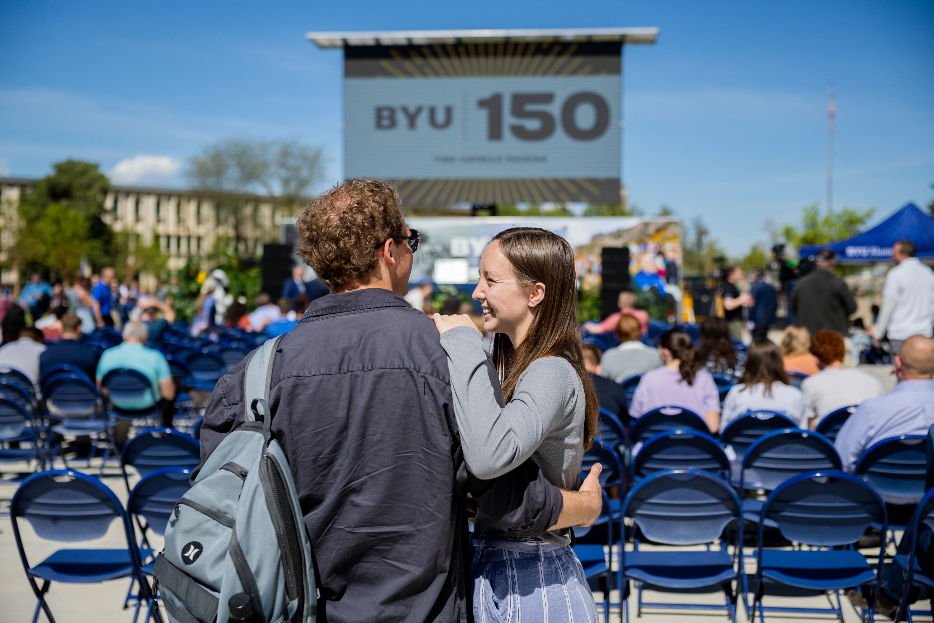 BYU student Alexandra Harding smiles at her boyfriend, BYU student Brady Dickerson, during a campus celebration before a time capsule packing party as part of BYU’s 150th anniversary celebration at Brigham Square in Provo on Tuesday. The capsule will be opened again in 2075.