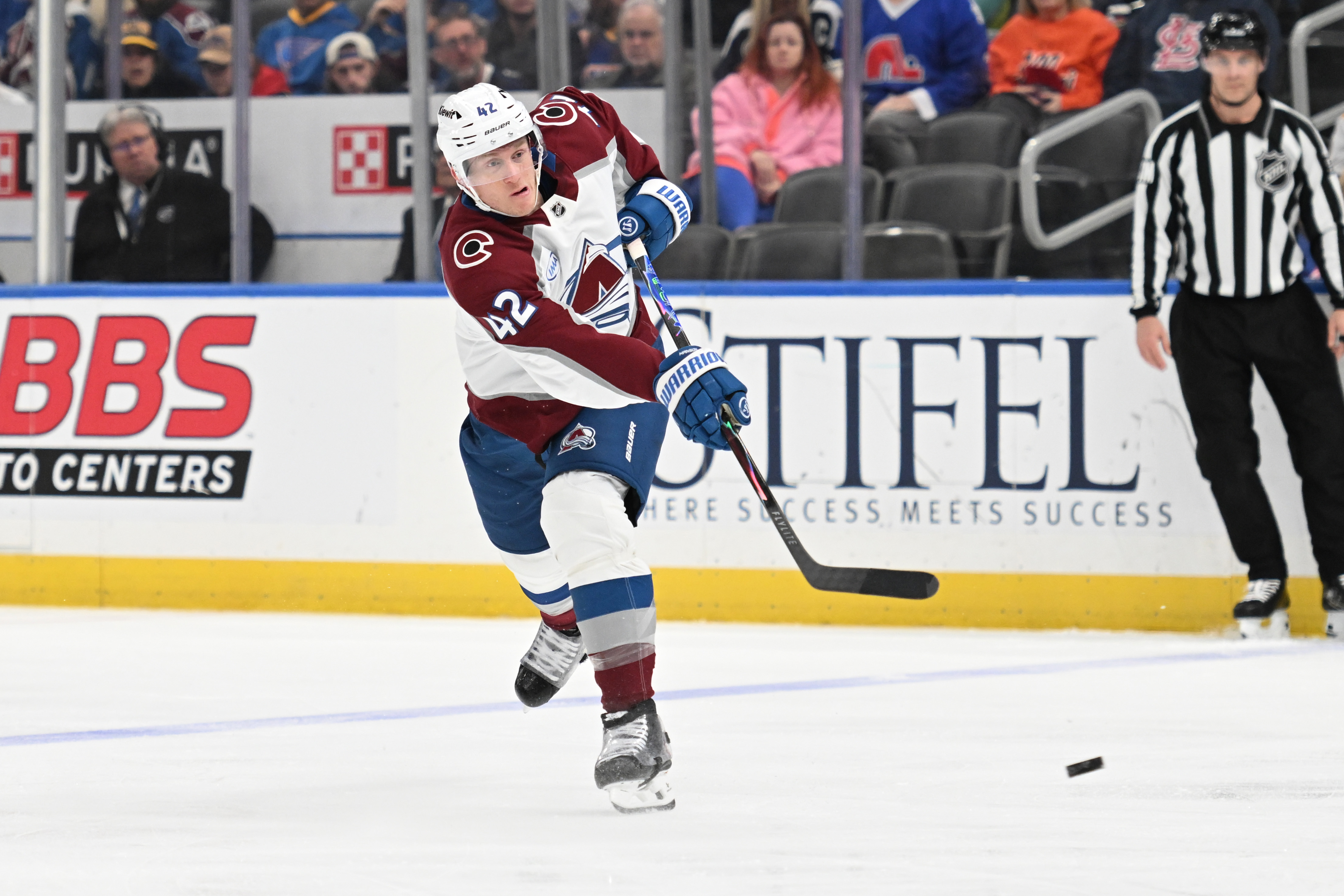 Colorado Avalanche's Josh Manson (42) takes a shot against the St. Louis Blues during the third period of an NHL hockey game, Tuesday, April 7, 2026, in St. Louis. 