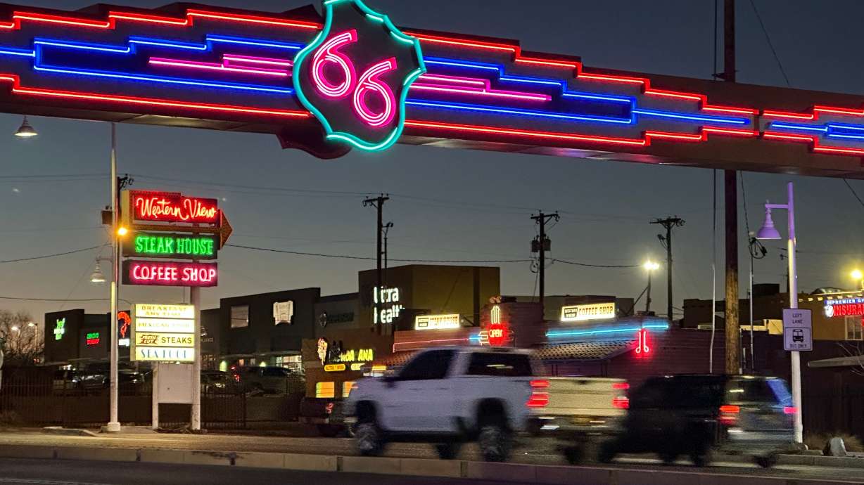 Traffic passes under a neon Route 66 sign on the west end of Albuquerque, N.M., Jan. 16. The historic route that passes through eight states recently turned 100.