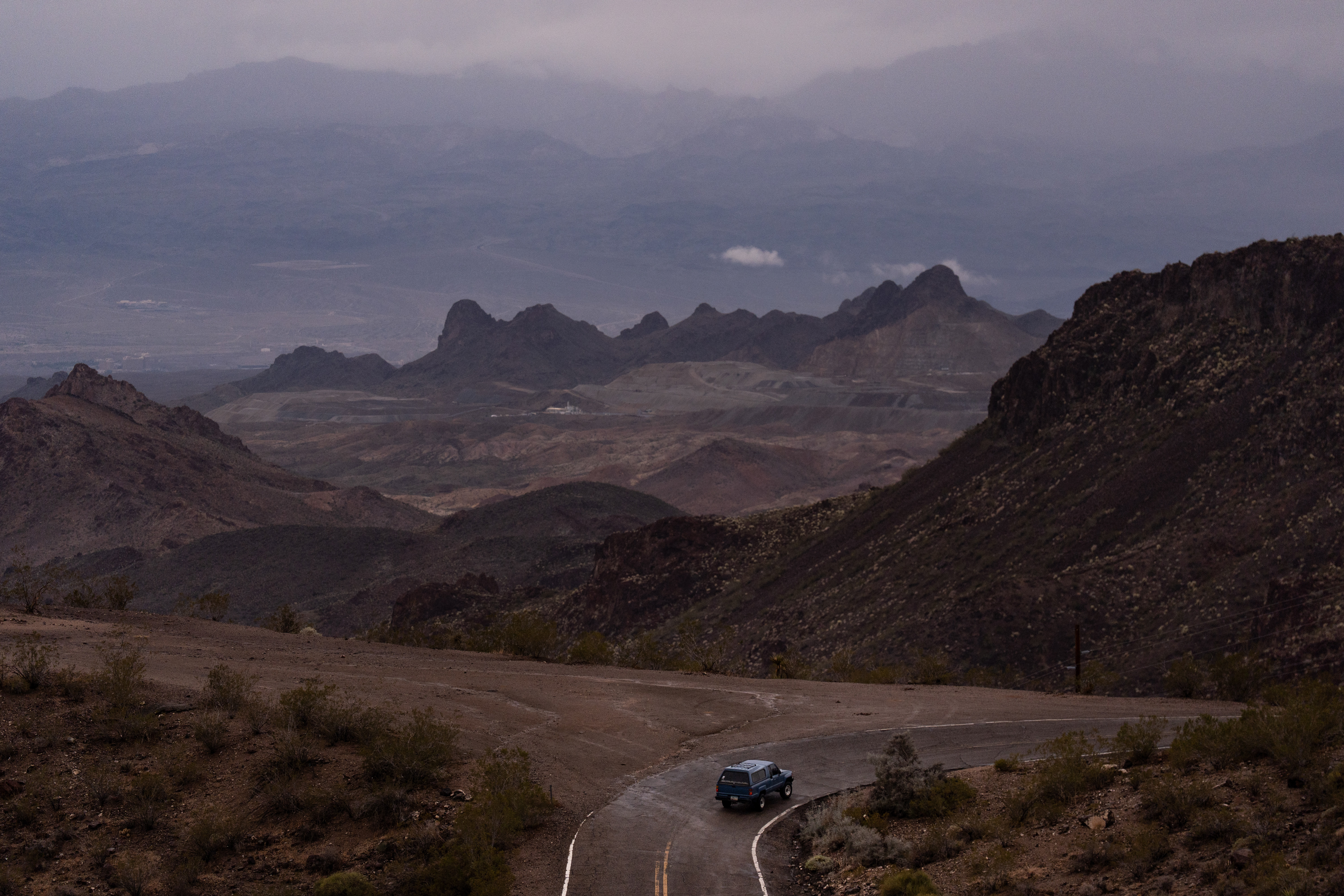 A car is driven along Oatman Highway, historic Route 66, near Oatman, Ariz., Nov. 21. The highway offers a different kind of solitude.