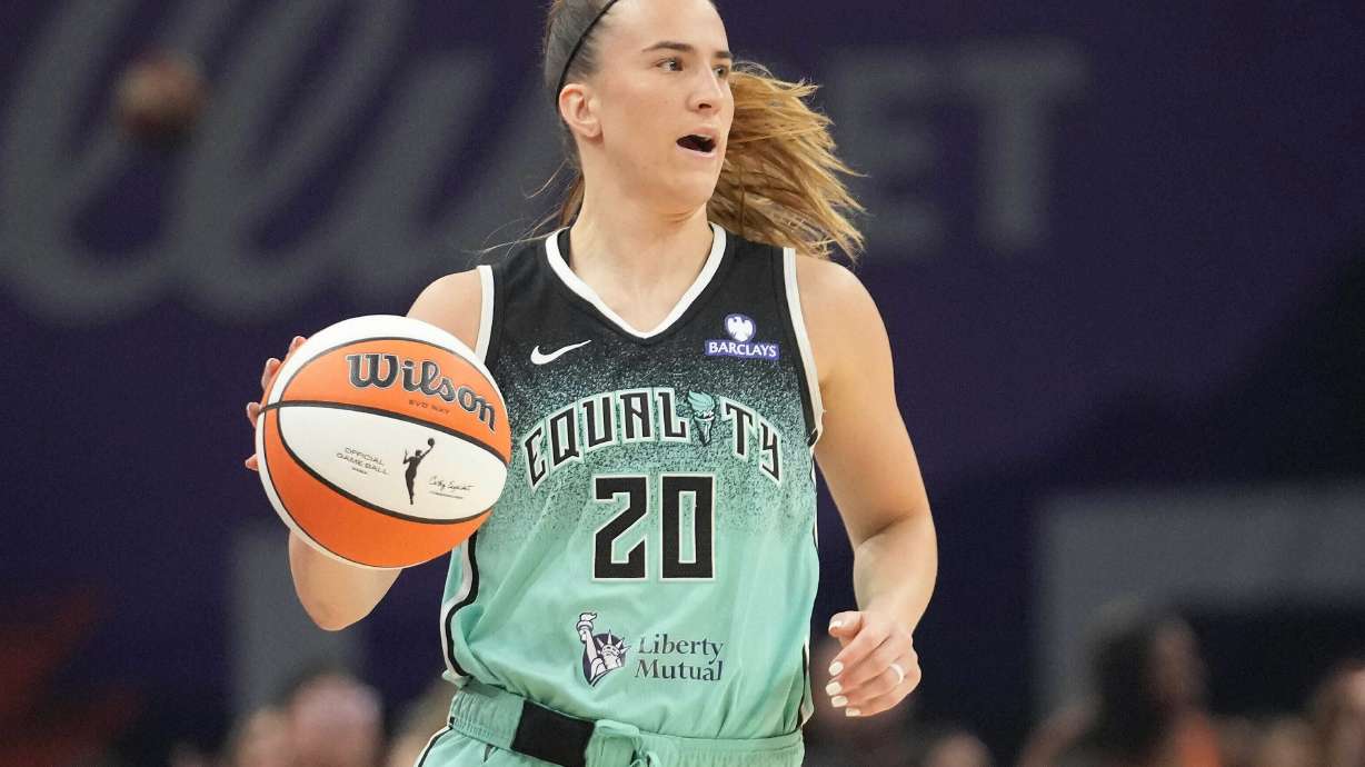 FILE - New York Liberty guard Sabrina Ionescu controls the ball against the Phoenix Mercury during the second half of Game 1 during the first round of the WNBA basketball playoffs Sept. 14, 2025, in Phoenix.
