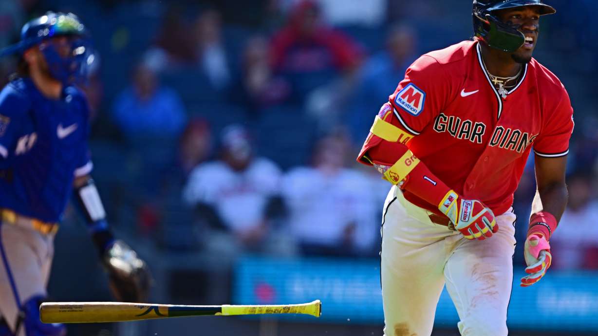 Cleveland Guardians' Angel Martinez watches his ball while running the bases after hitting a grand slam off Kansas City Royals relief pitcher Steven Cruz during the eighth inning of a baseball game, Wednesday, April 8, 2026, in Cleveland.