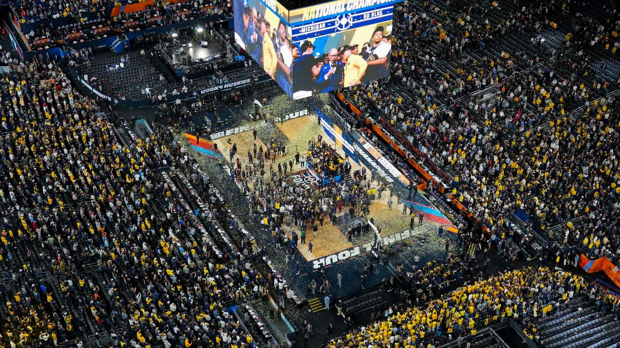 Michigan celebrates after defeating UConn in the NCAA college basketball tournament national championship game at the Final Four, Monday, April 6, 2026, in Indianapolis.