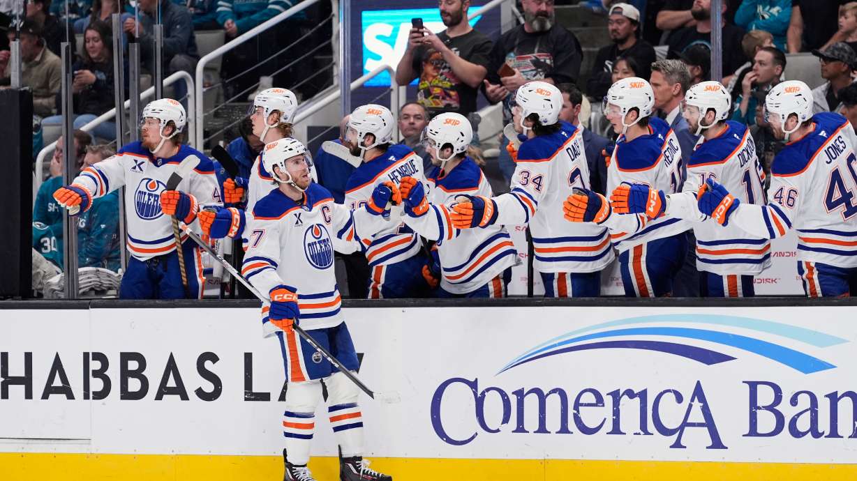 Edmonton Oilers center Connor McDavid (97) celebrates with teammates after scoring a goal during the first period of an NHL hockey game against the San Jose Sharks, Wednesday, April 8, 2026, in San Jose, Calif.