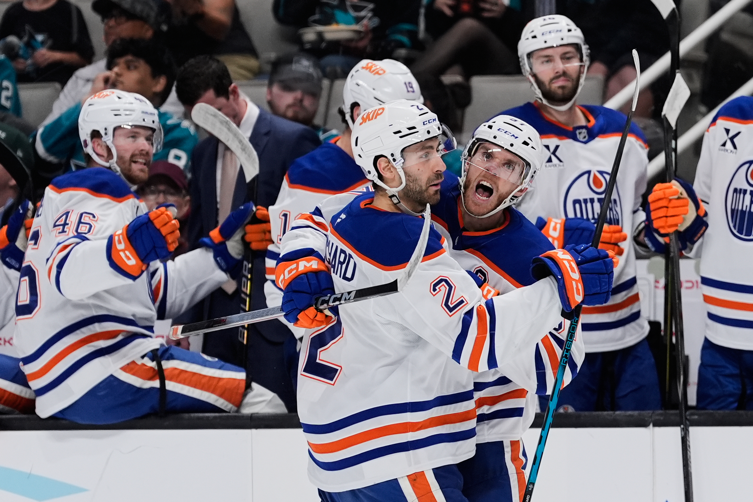 Edmonton Oilers center Connor McDavid, right, celebrates with defenseman Evan Bouchard (2) after scoring a goal during the second period of an NHL hockey game against the San Jose Sharks, Wednesday, April 8, 2026, in San Jose, Calif. 