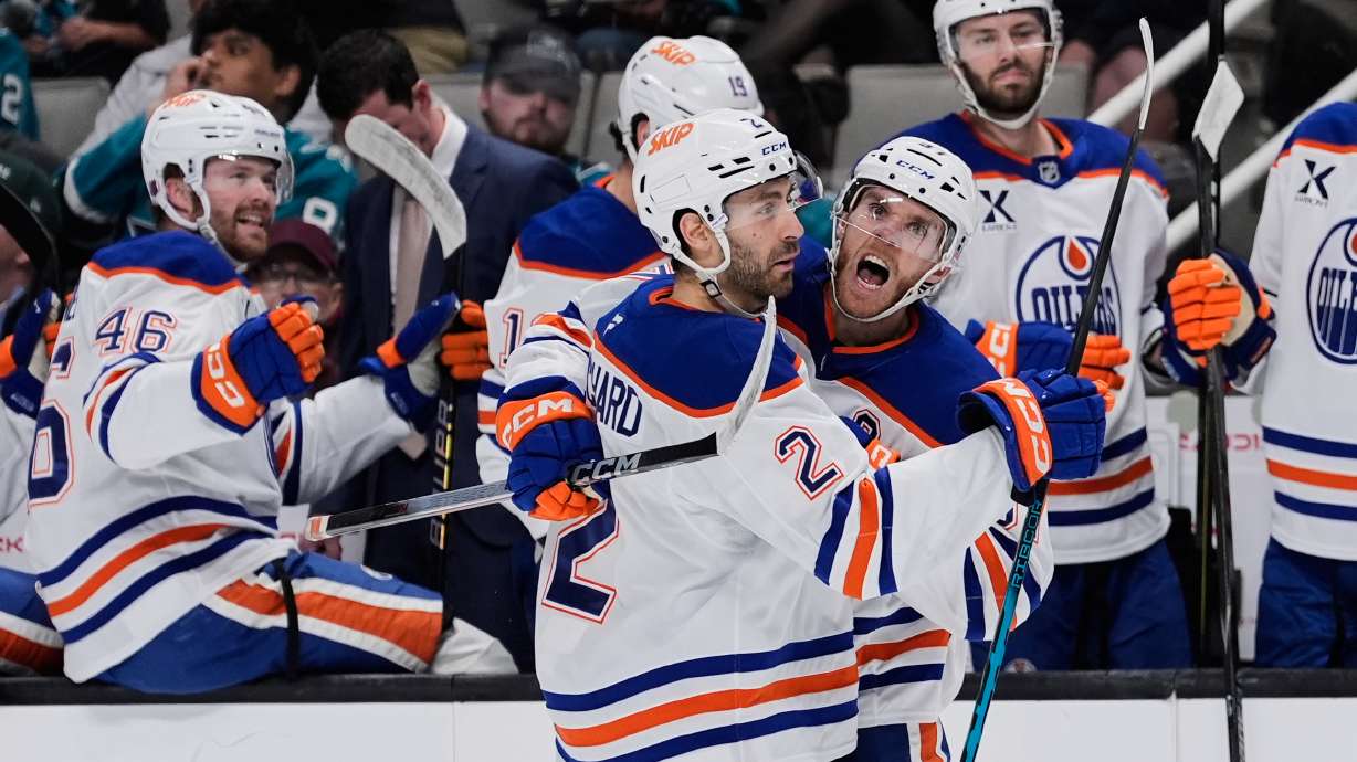 Edmonton Oilers center Connor McDavid, right, celebrates with defenseman Evan Bouchard (2) after scoring a goal during the second period of an NHL hockey game against the San Jose Sharks, Wednesday, April 8, 2026, in San Jose, Calif.