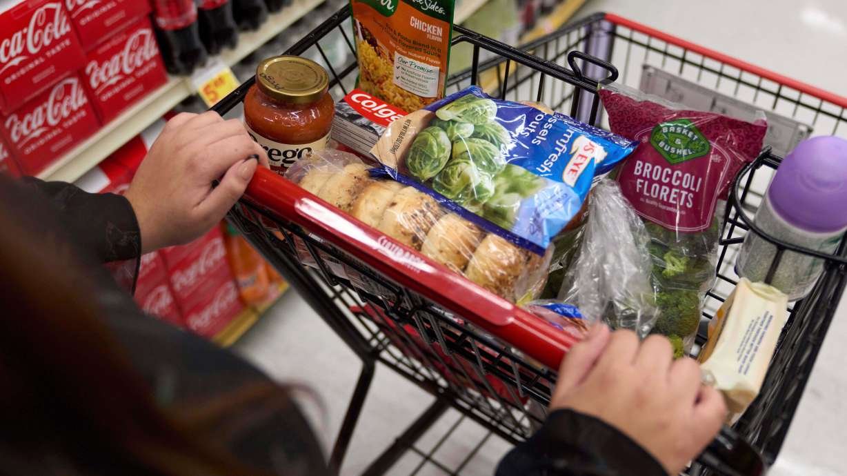 A California's SNAP benefits shopper pushes a cart through a supermarket in Bellflower, Calif., Feb. 13, 2023. A key measure of inflation stayed high in February, before the war in Iran spiked gas prices, a sign that everyday costs were elevated even before the conflict began.