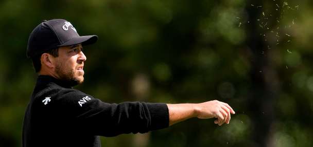 Xander Schauffele's shot lands in a viewer's merchandise bag. It didn't stop him from making par
