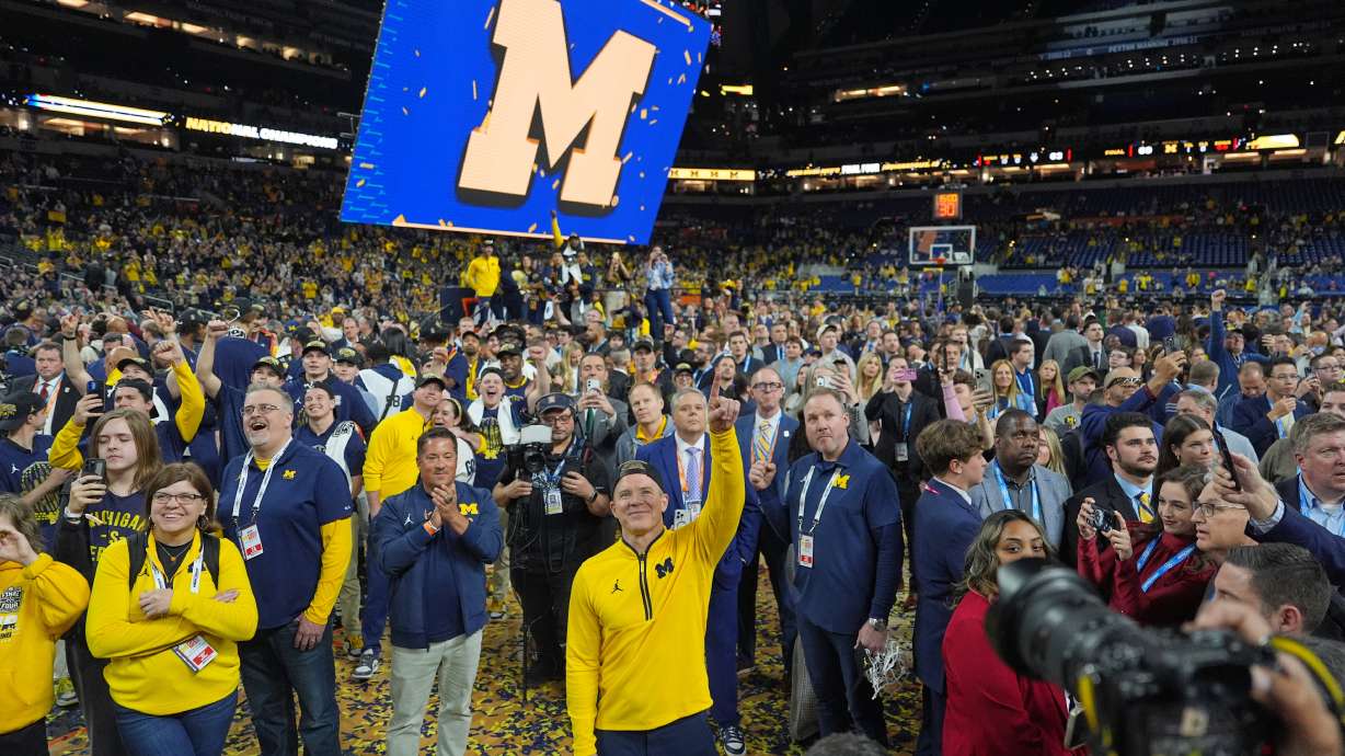 Michigan head coach Dusty May celebrates after defeating UConn in the NCAA college basketball tournament national championship game at the Final Four, Tuesday, April 7, 2026, in Indianapolis.