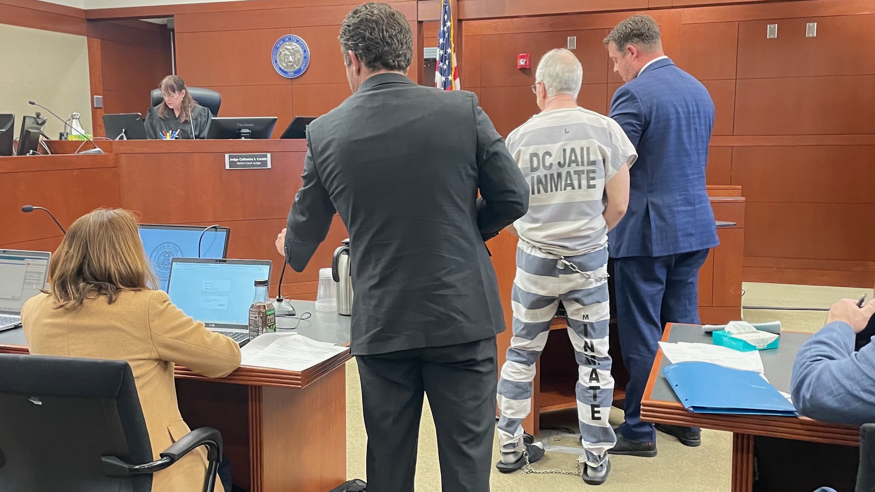 Former 1st District Court Judge Kevin Christensen, in the prison jumpsuit, stands with his attorney Ryan Bushell during a hearing in his criminal case on Thursday in 2nd District Court in Ogden. He pleaded guilty to three felony charges, one for sexually enticing a minor, as part of a plea deal in his case.