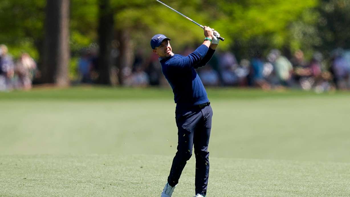 Rory McIlroy, of Northern Ireland, hits from the fairway on the 15th hole during the first round of the Masters golf tournament at the Augusta National Golf Club, Thursday, April 9, 2026, in Augusta, Ga.
