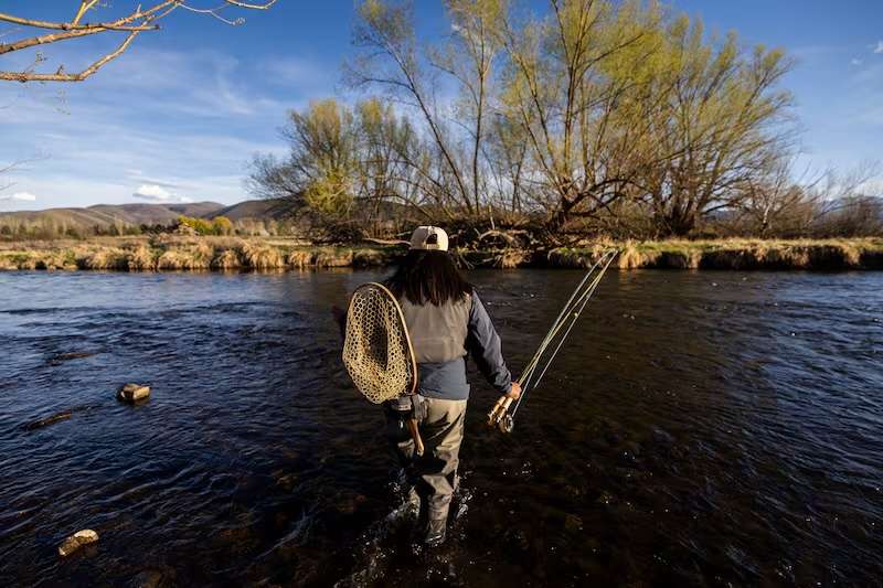 Rebeca Granillo, a fly-fishing instructor from Millcreek, crosses the Provo River near Charleston on Wednesday, April 8, 2026.