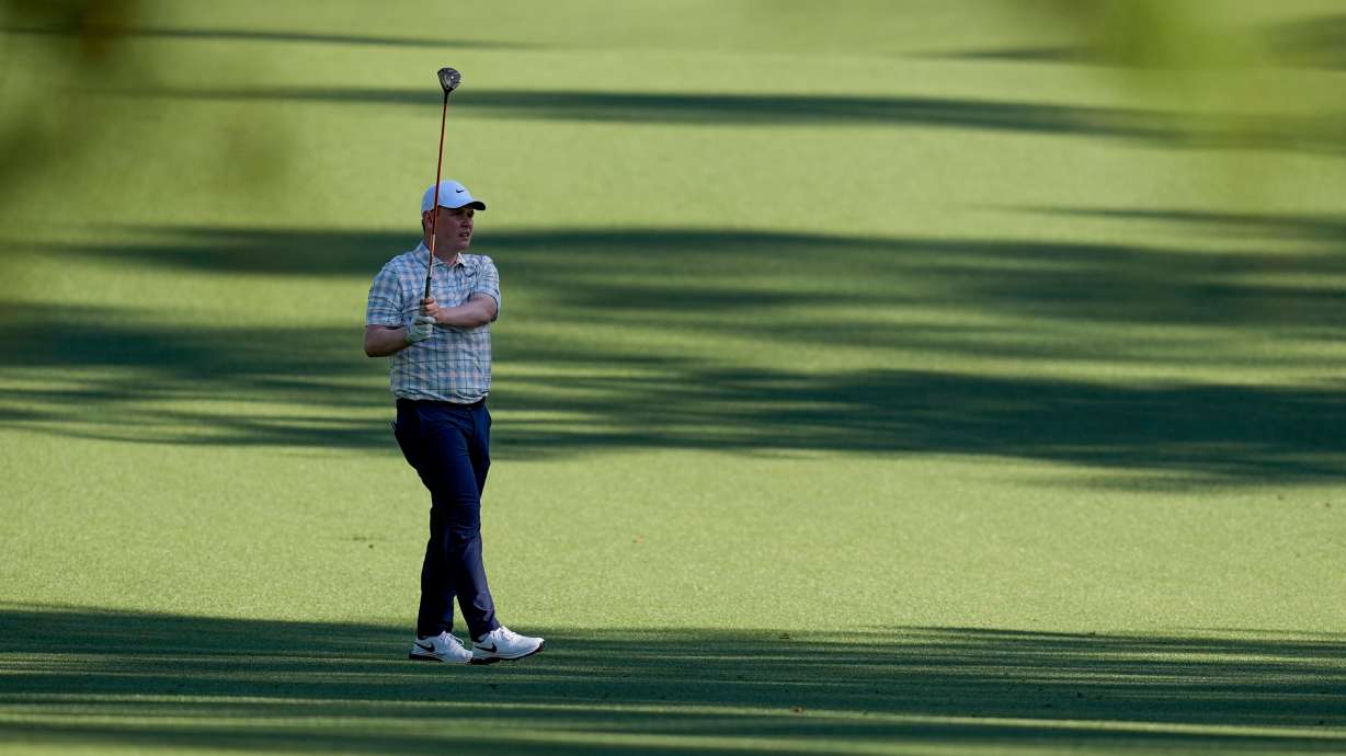 Robert MacIntyre, of Scotland, hits from the fairway on the 13th hole during the first round of the Masters golf tournament at the Augusta National Golf Club, Thursday, April 9, 2026, in Augusta, Ga.