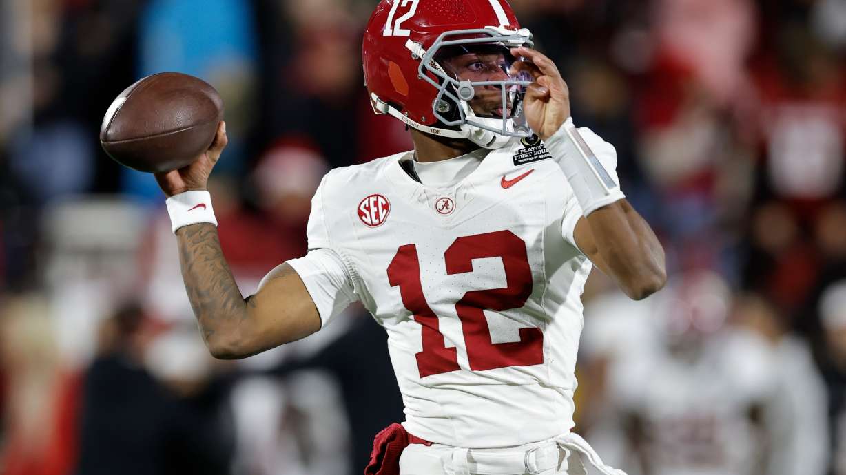 FILE - Alabama quarterback Keelon Russell (12) warms up before the first round of an NCAA College Football Playoff against Oklahoma, Friday, Dec. 19, 2025, in Norman, Okla.