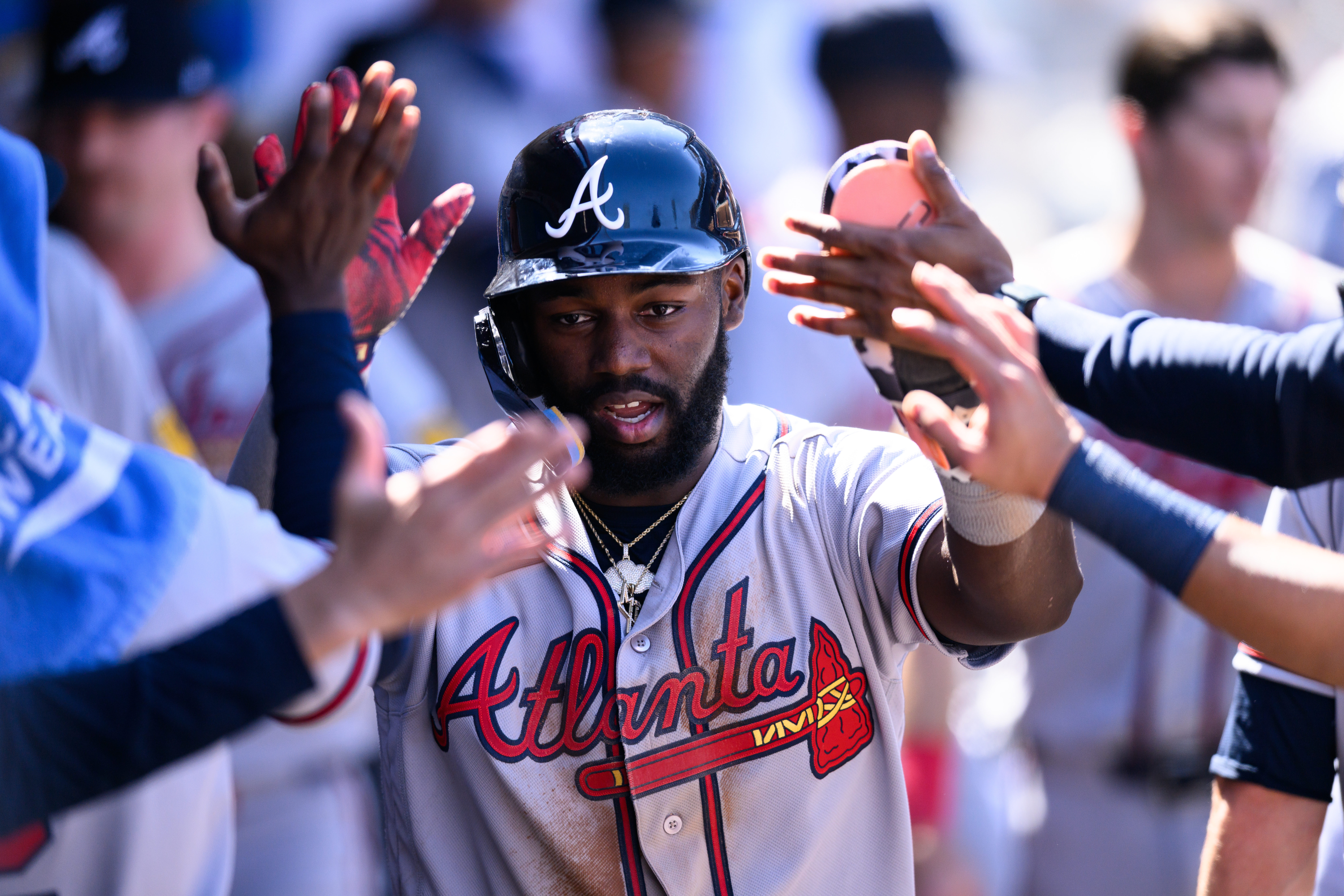 Atlanta Braves' Michael Harris II is greeted by teammates after scoring during the sixth inning of a baseball game against the Los Angeles Angels, Wednesday, April 8, 2026, in Anaheim, Calif. 