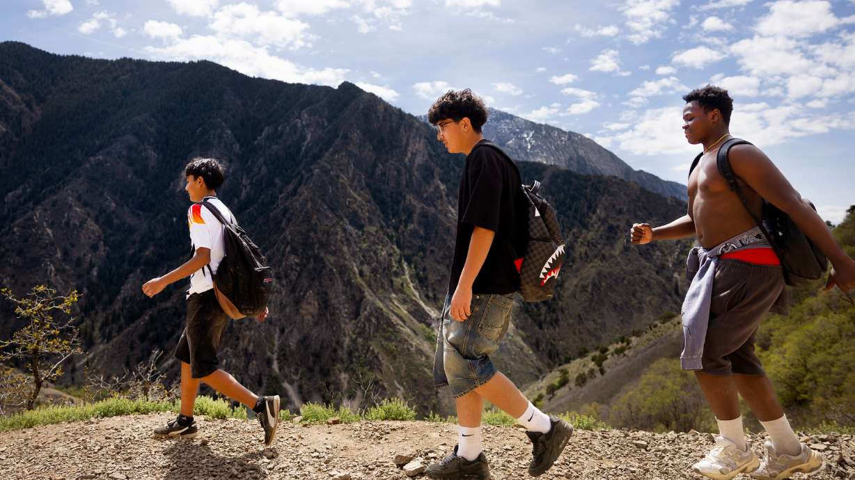 Mateo Zambrano, Osama Souid and Enoch Kulang hike in Millcreek Canyon in Salt Lake City on Wednesday. The Department of Agriculture on Thursday refuted allegations that the Trump administration was dismantling the U.S. Forest Service.