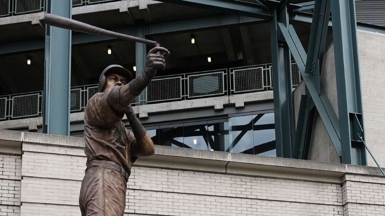 The bat on the statue of former Seattle Mariners right fielder Ichiro Suzuki is broken during the unveiling ceremony outside of T-Mobile Park, Friday, April 10, 2026, in Seattle.