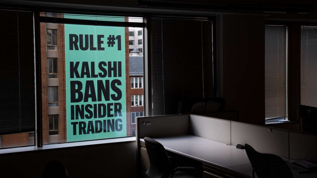 A banner for the prediction market platform Kalshi hangs from a building in Washington, April 1. A federal judge on Friday temporarily barred Arizona from enforcing its gambling laws against predictive market operators.