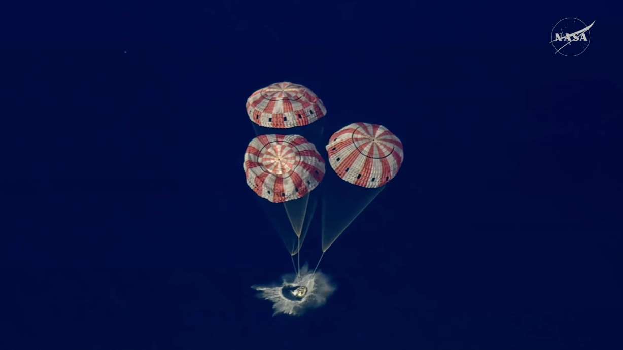 In this image from video provided by NASA, the Artemis II Orion capsule splashes down in the Pacific Ocean, on Friday. The splashdown officially occurred at 6:07 p.m. MDT.
