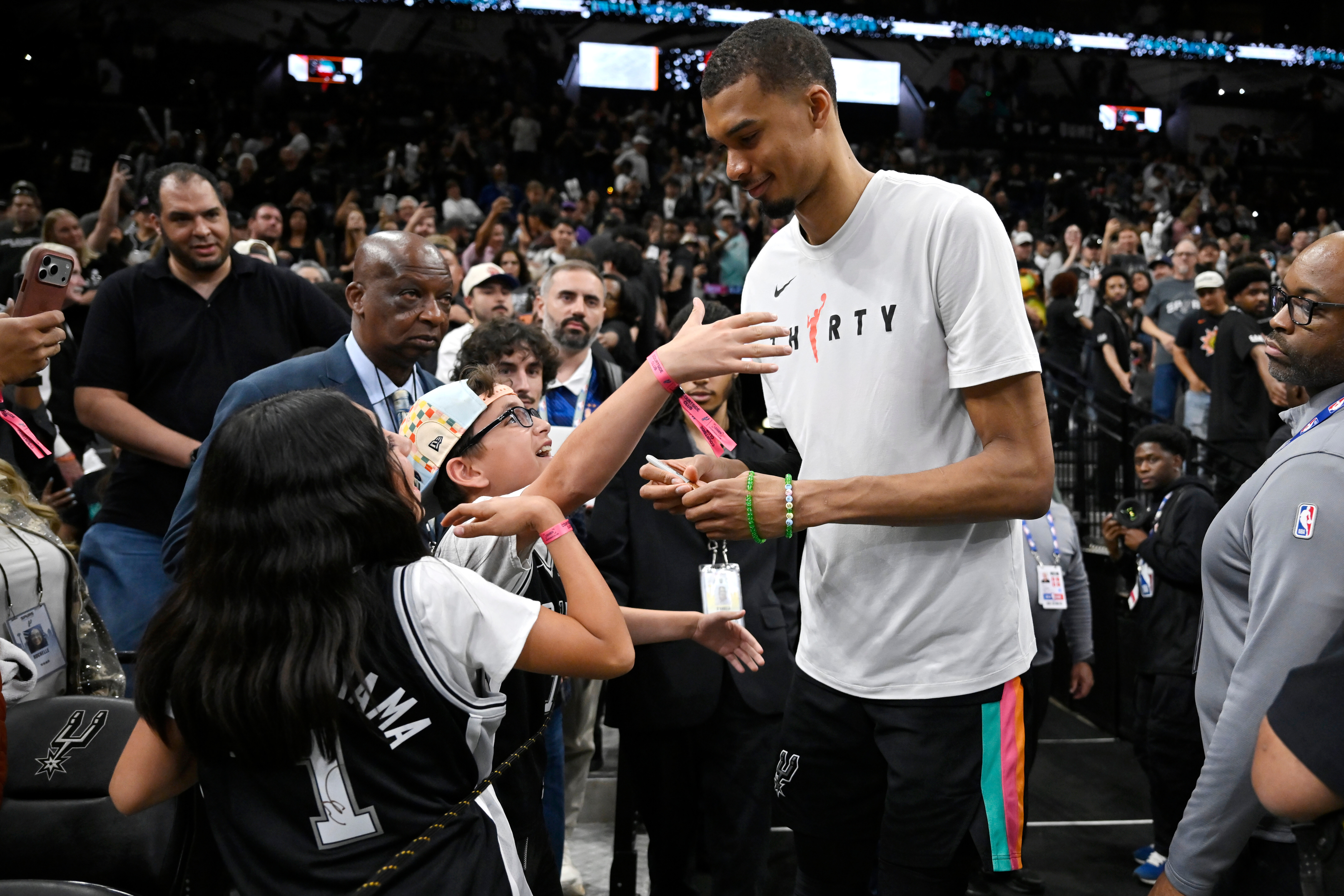 San Antonio Spurs center Victor Wembanyama, center right, greets fans after an NBA basketball game against the Dallas Mavericks, Friday, April 10, 2026, in San Antonio. 