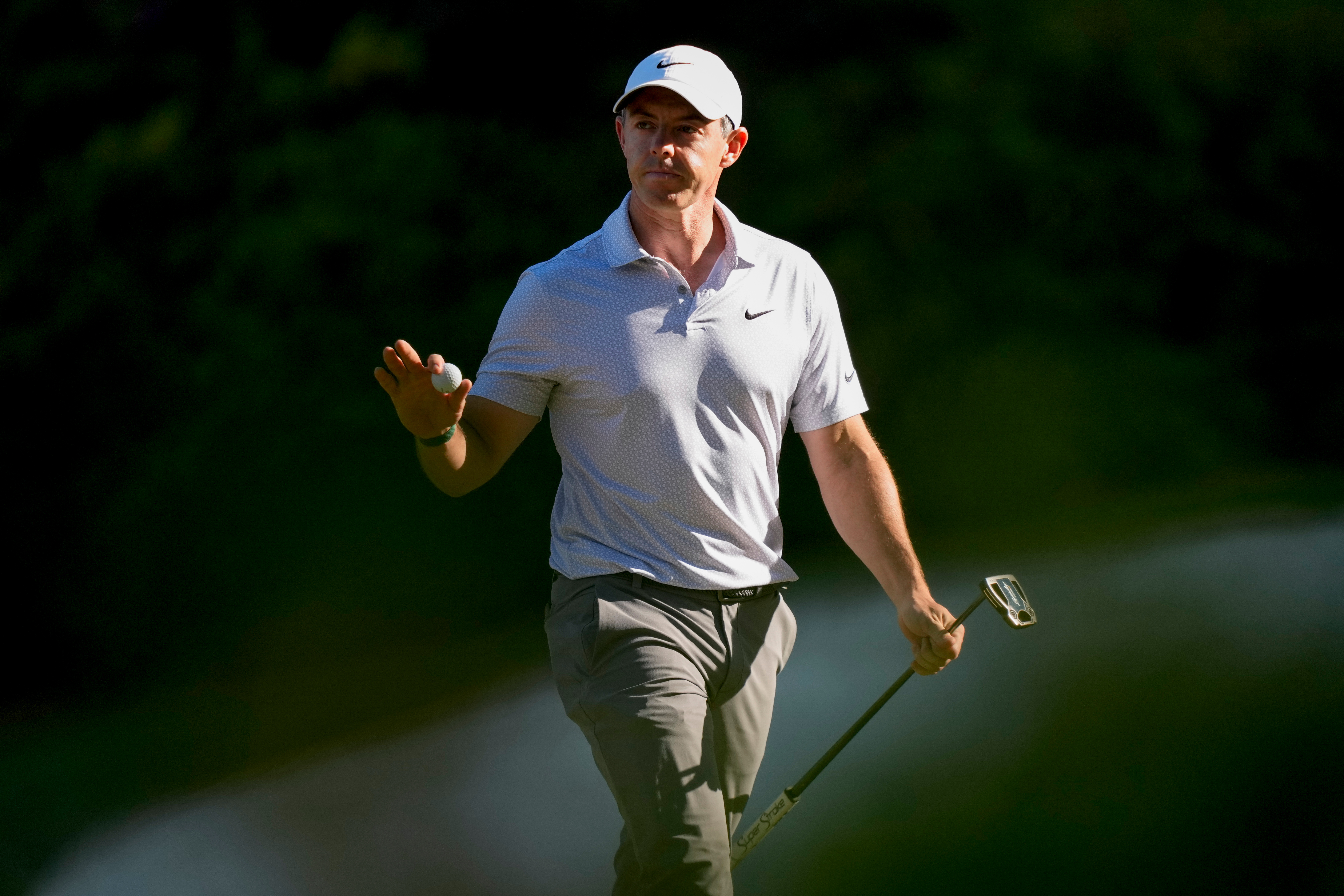 Rory McIlroy, of Northern Ireland, waves after his putt on the 13th hole during the second round of the Masters golf tournament at the Augusta National Golf Club, Friday, April 10, 2026, in Augusta, Ga.