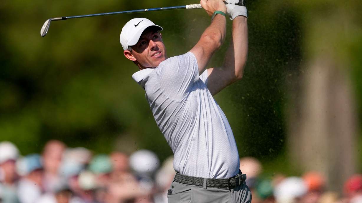 Rory McIlroy, of Northern Ireland, watches his tee shot on the 12th hole during the second round of the Masters golf tournament at the Augusta National Golf Club, Friday, April 10, 2026, in Augusta, Ga.