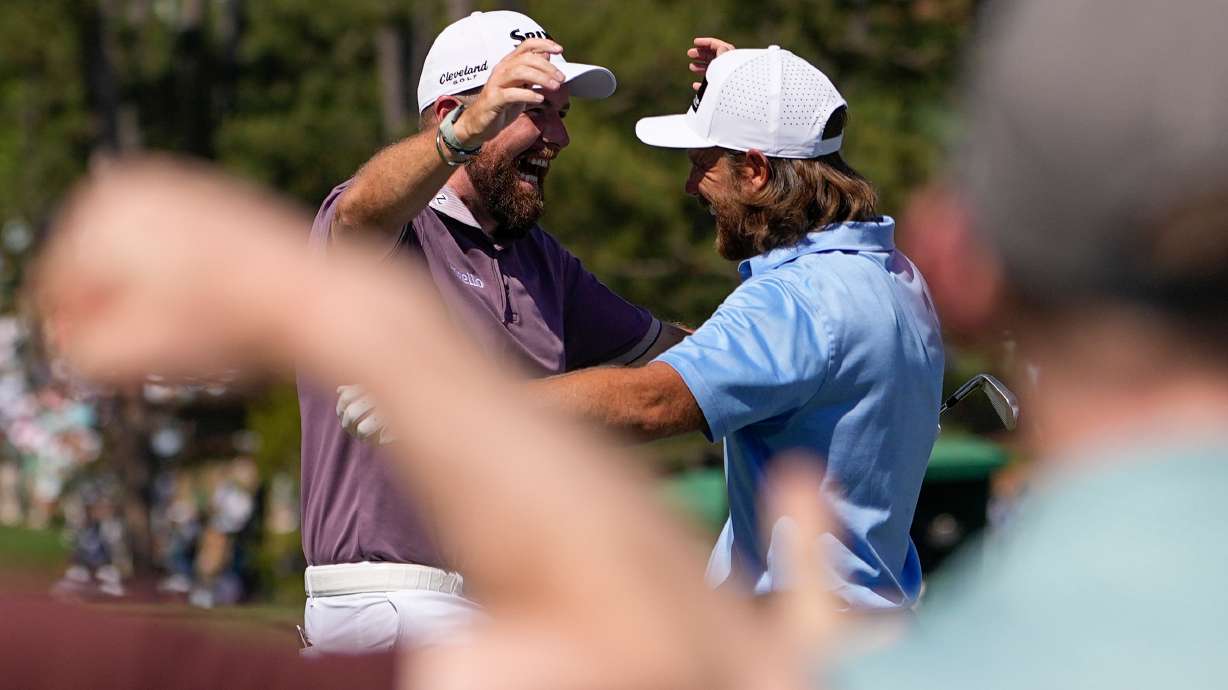 Shane Lowry, of Ireland, waves after a hole-in-one on the sixth hole during the third round of the Masters golf tournament at the Augusta National Golf Club, Saturday, April 11, 2026, in Augusta, Ga.