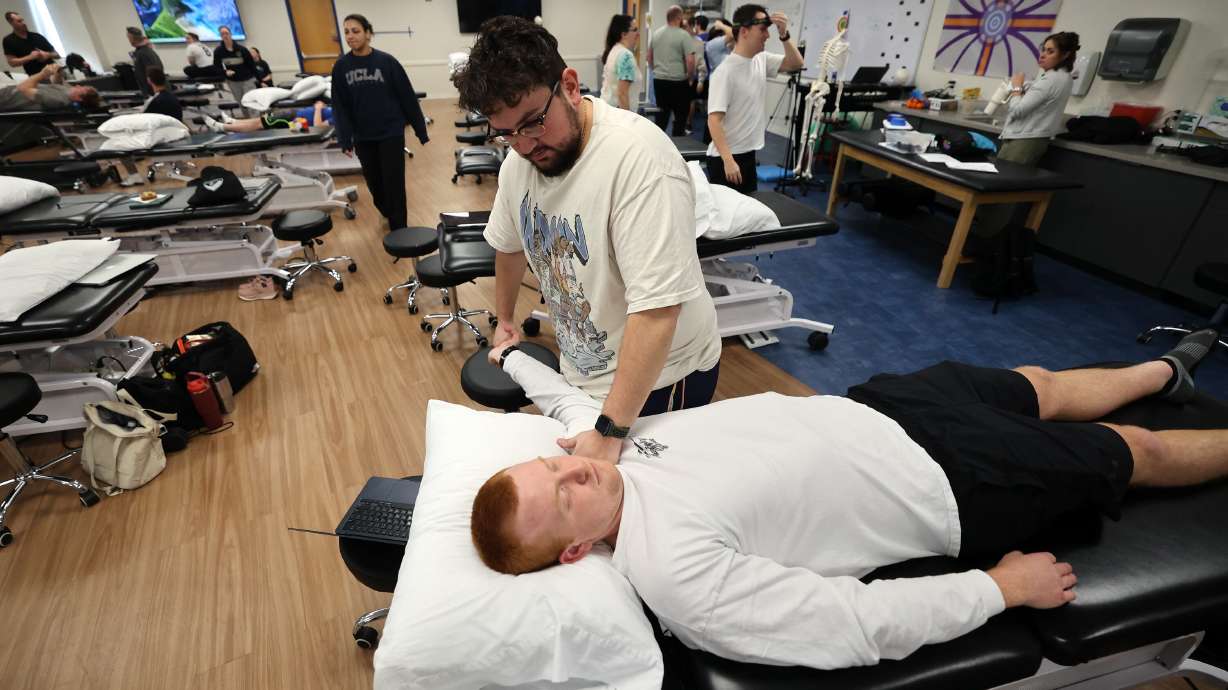 Second-year doctor of physical therapy student Kaden Kennard does upper limb nerve testing on fellow second-year student Kyle Watkins at Rocky Mountain University in Provo on Jan. 14.
