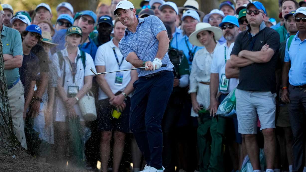 Rory McIlroy, of Northern Ireland, hits from the pine straw on the 17th hole during the third round of the Masters golf tournament at the Augusta National Golf Club, Saturday, April 11, 2026, in Augusta, Ga.