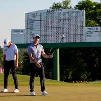 The Latest: Final round of the Masters heats up