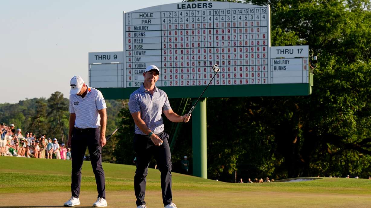 Rory McIlroy, of Northern Ireland, waves after his putt on the 18th hole during the third round of the Masters golf tournament at the Augusta National Golf Club, Saturday, April 11, 2026, in Augusta, Ga.
