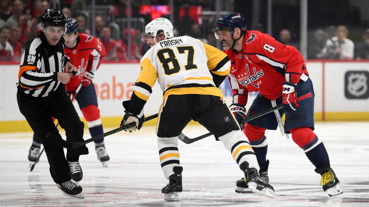 Washington Capitals left wing Alex Ovechkin (8) looks on after he faced off with Pittsburgh Penguins center Sidney Crosby (87) during the first period of an NHL hockey game, Sunday, April 12, 2026, in Washington.