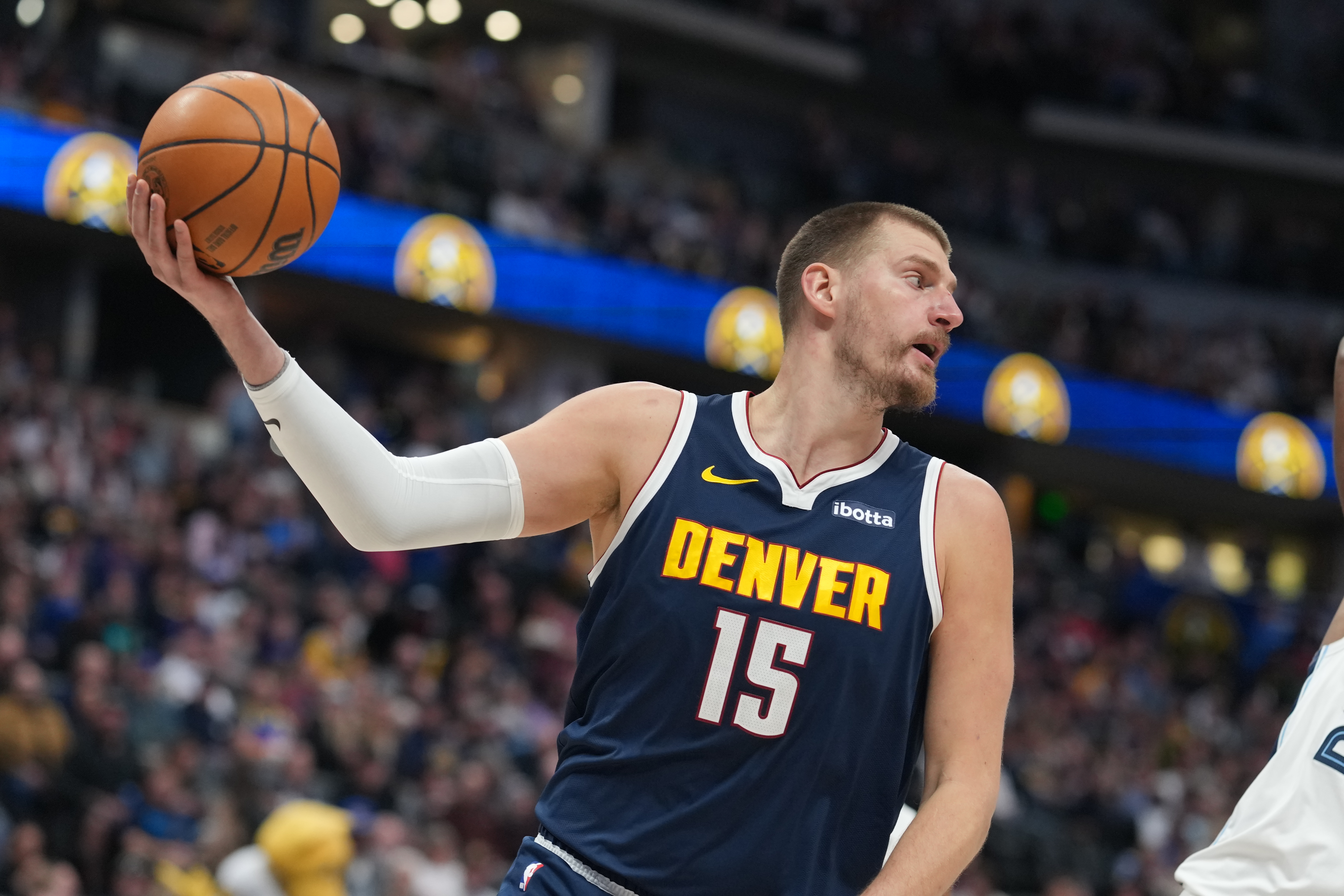 Denver Nuggets center Nikola Jokić pulls in a loose ball in the first half of an NBA basketball game against the Memphis Grizzlies Wednesday, April 8, 2026, in Denver. 