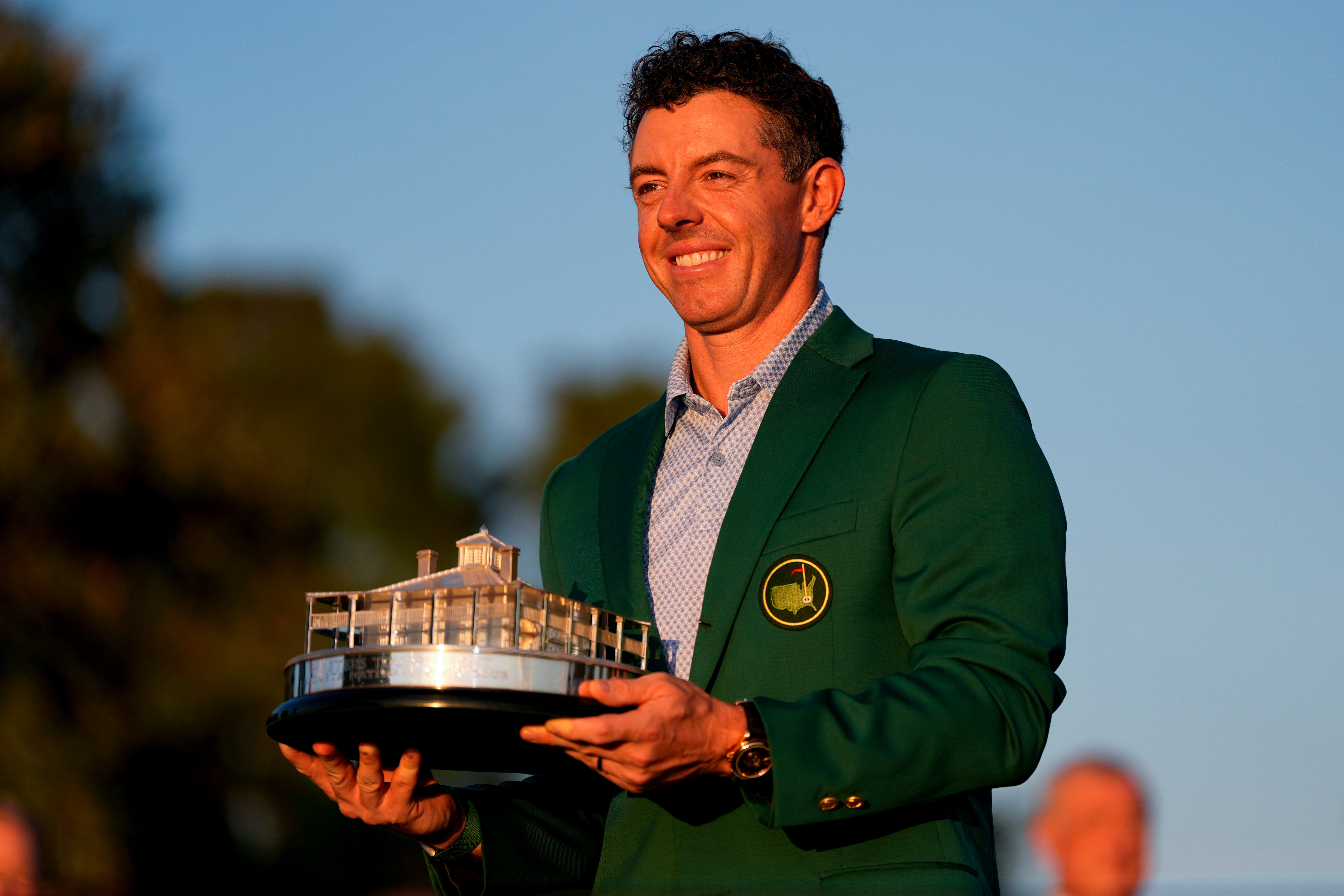 Rory McIlroy, of Northern Ireland, holds the trophy after winning the Masters golf tournament at the Augusta National Golf Club, Sunday, April 12, 2026, in Augusta, Ga.