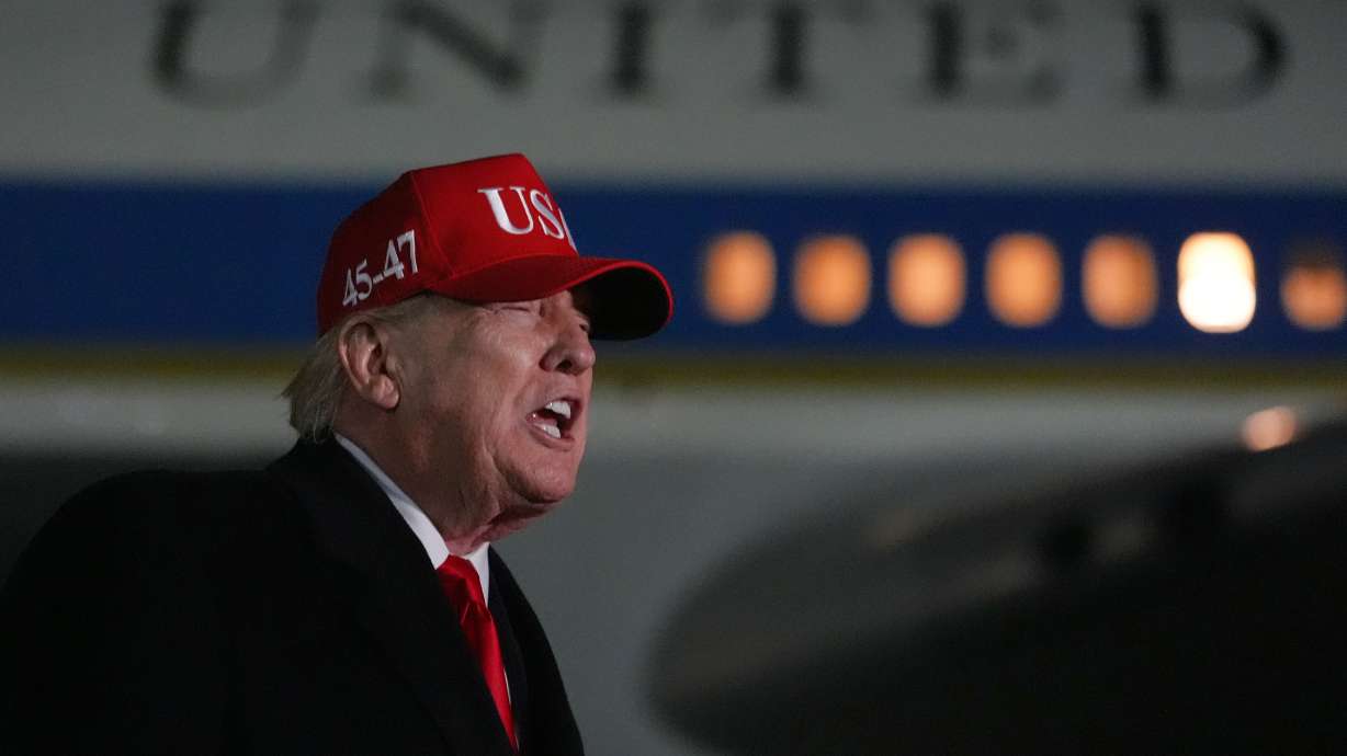 President Donald Trump speaks with reporters at Joint Base Andrews, Md., Sunday, after he returned from Miami. Trump is refusing to apologize to Pope Leo XIV after criticizing the pontiff's opposition to the war in Iran.