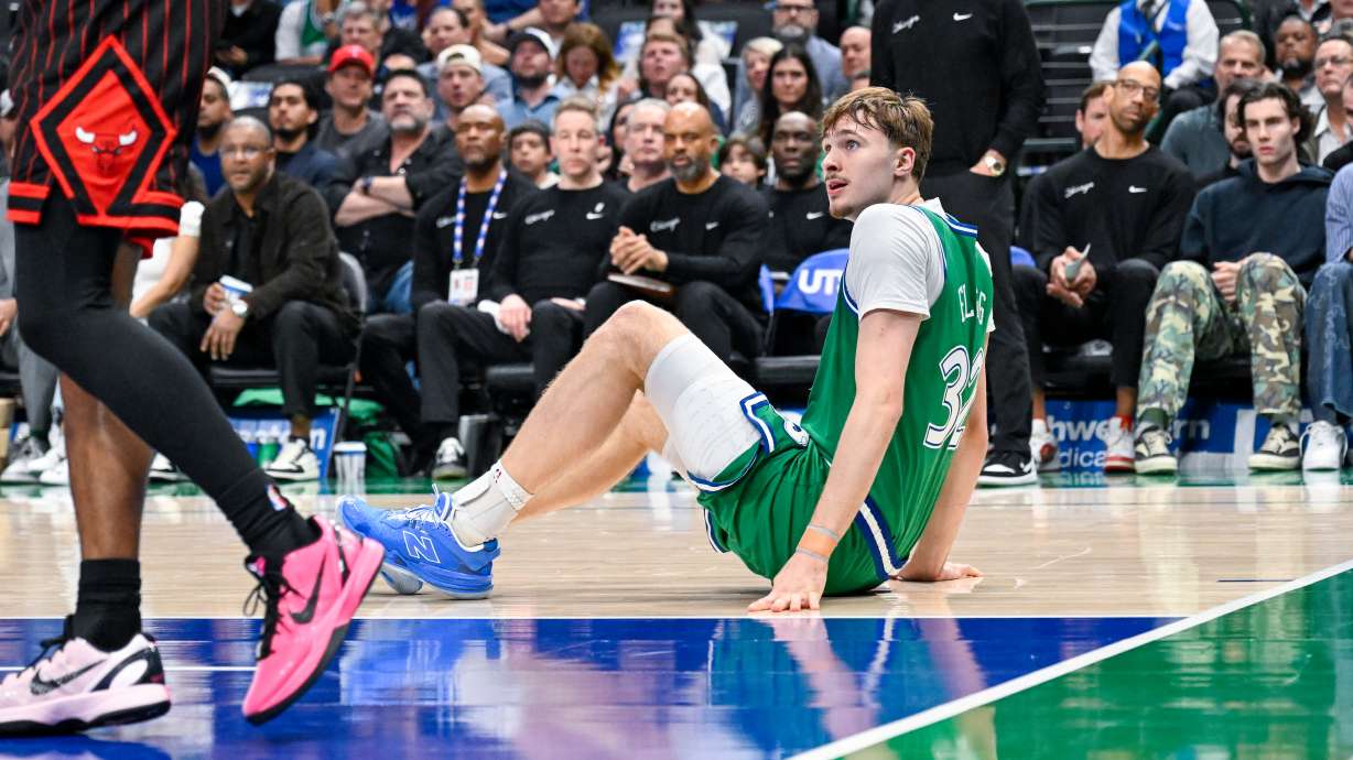 Dallas Mavericks' Cooper Flagg, right, is injured during an NBA basketball game against the Chicago Bulls, Sunday, April 12, 2026, in Dallas.