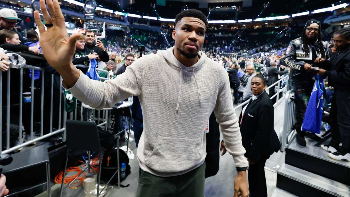 Milwaukee Bucks forward Giannis Antetokounmpo, center, walks off the court after an NBA basketball game against the Brooklyn Nets, Friday, April 10, 2026, in Milwaukee.