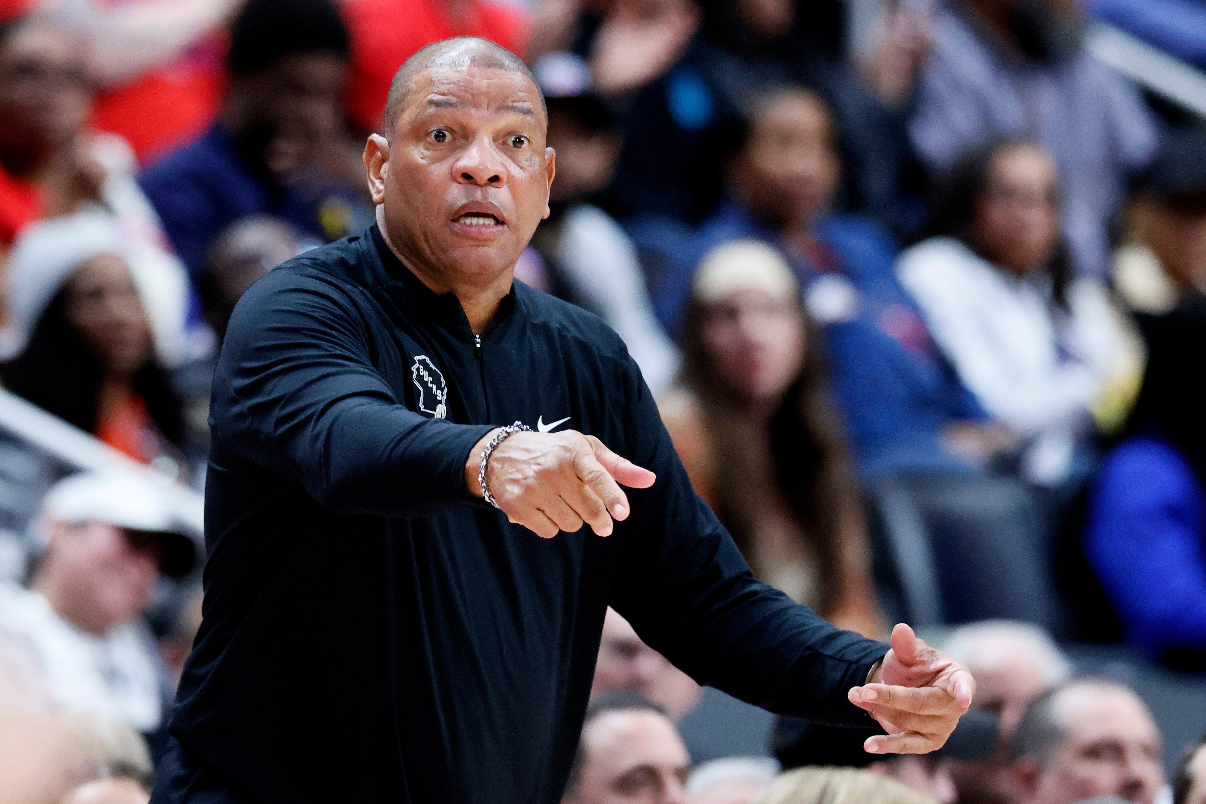 Milwaukee Bucks head coach Doc Rivers directs his payers against the Detroit Pistons during the first half of an NBA basketball game Wednesday, April 8, 2026, in Detroit.
