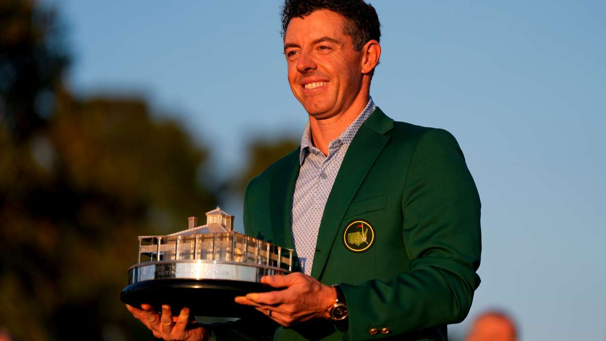 Rory McIlroy, of Northern Ireland, holds the trophy after winning the Masters golf tournament at the Augusta National Golf Club, Sunday, April 12, 2026, in Augusta, Ga.