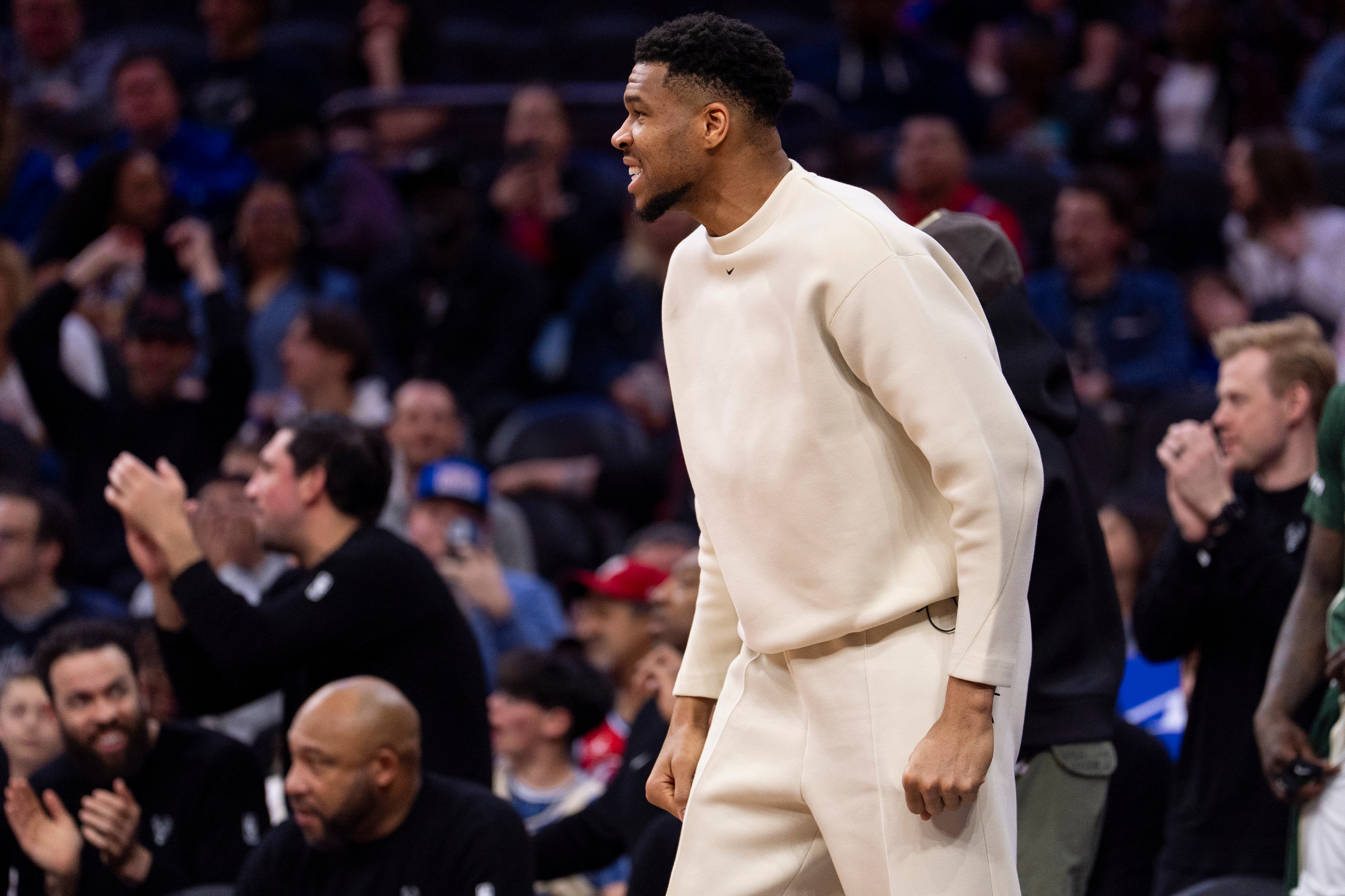 Milwaukee Bucks power forward Giannis Antetokounmpo, center, reacts from the sideline during the first half of an NBA basketball game against the Philadelphia 76ers, Sunday, April 12, 2026, in Philadelphia.