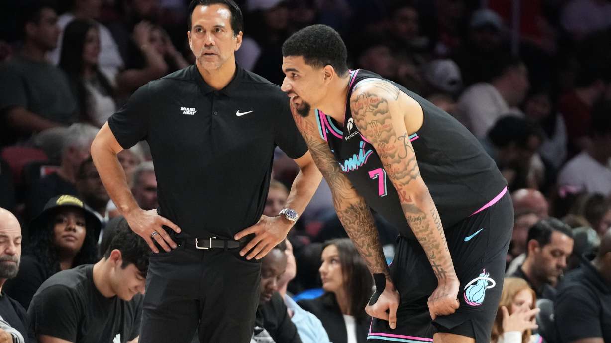 Miami Heat head coach Erik Spoelstra listens to center Kel'el Ware (7) during the second half of an NBA basketball game against the Washington Wizards Saturday, April 4, 2026, in Miami.