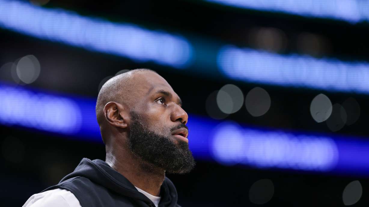 Los Angeles Lakers forward LeBron James looks on before an NBA basketball game against the Phoenix Suns, Friday, April 10, 2026, in Los Angeles.