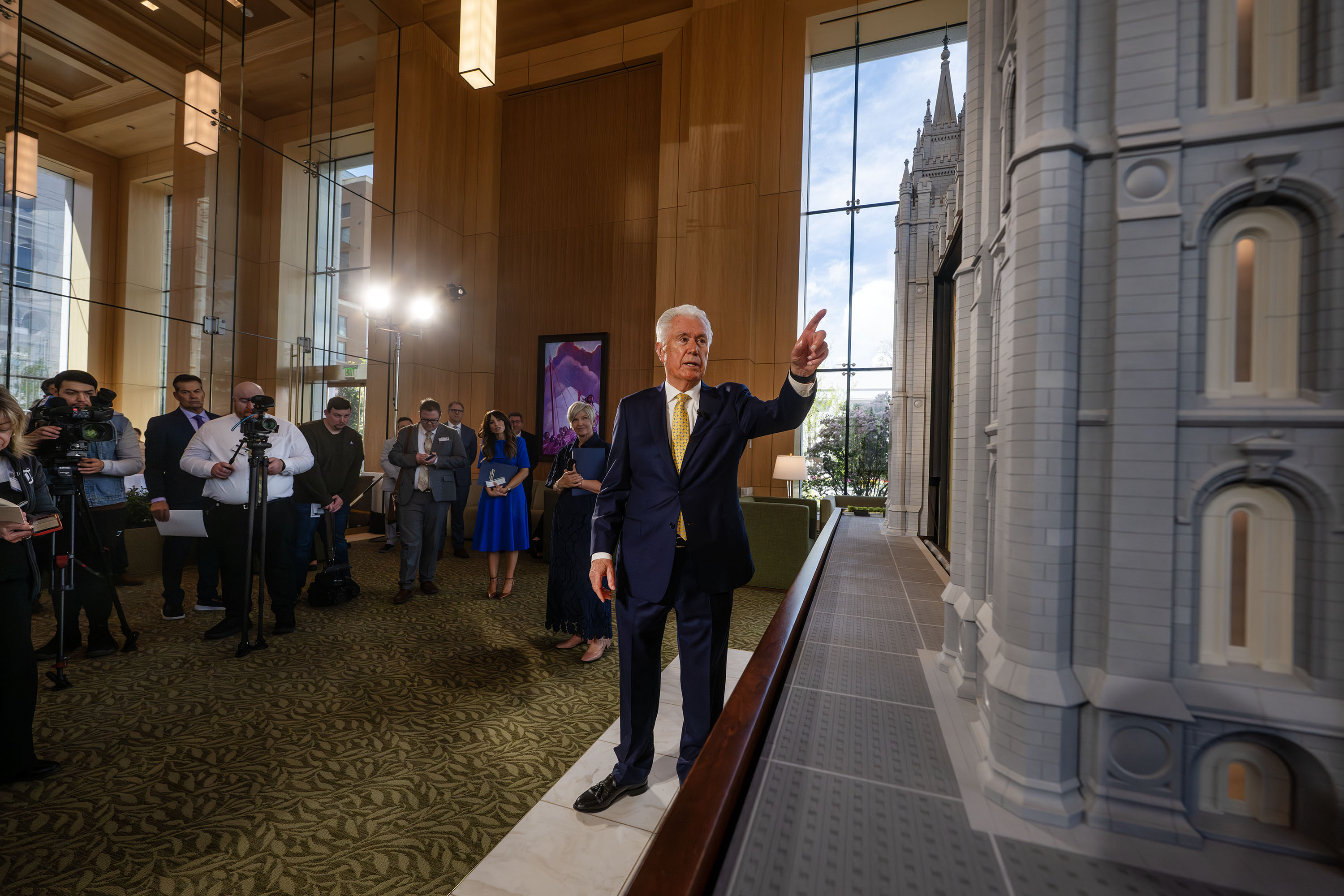 President Dieter F. Uchtdorf, acting president of the Quorum of the Twelve Apostles, talks about the Salt Lake Temple after he and President Emily Belle Freeman, Young Women general president for The Church of Jesus Christ of Latter-day Saints, lead media members on a tour of the new visitors' center on Temple Square in Salt Lake City on Monday.